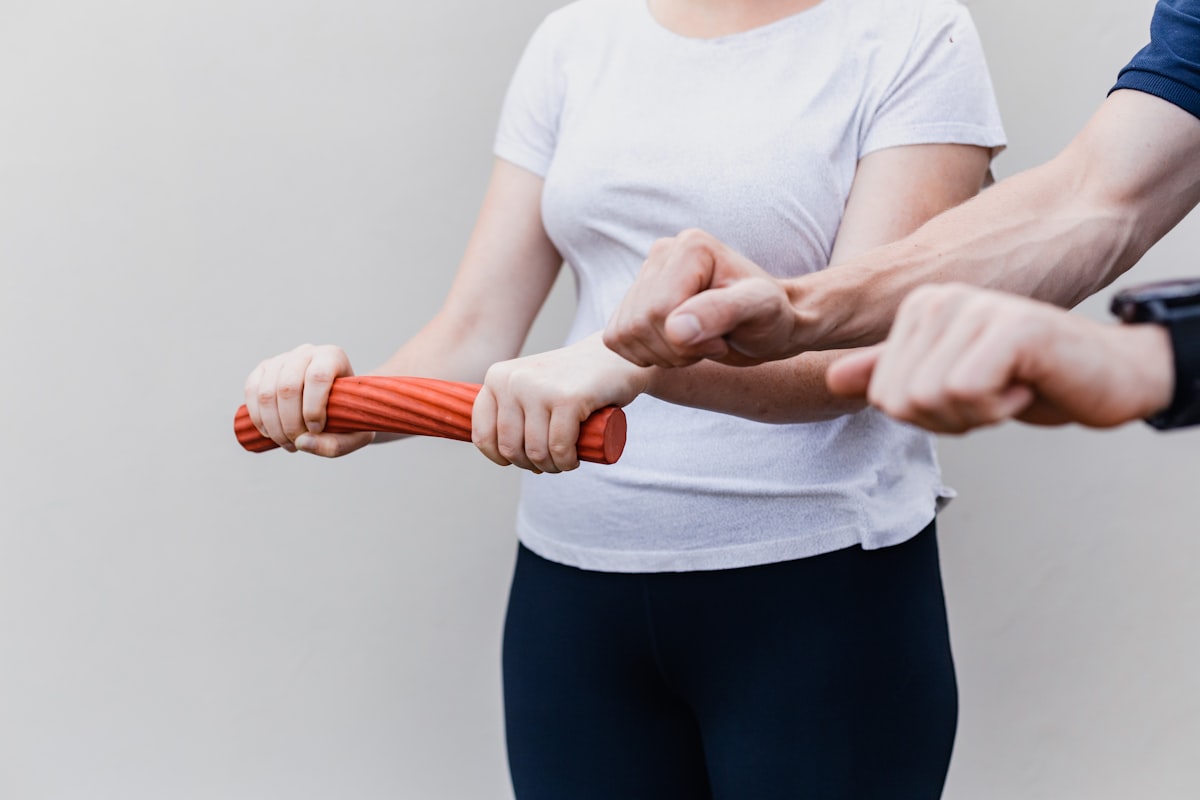 Professional kinesiotherapy session showing movement and strengthening exercises